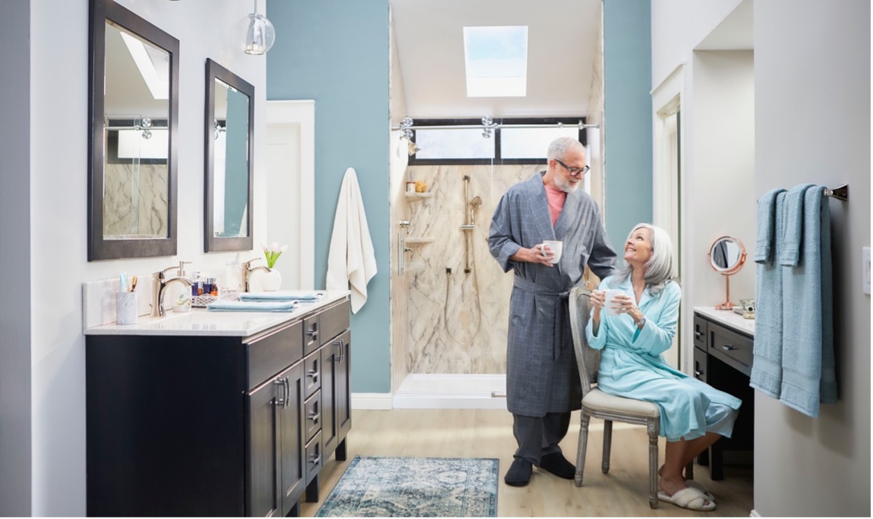 happy older couple in remodeled bathroom