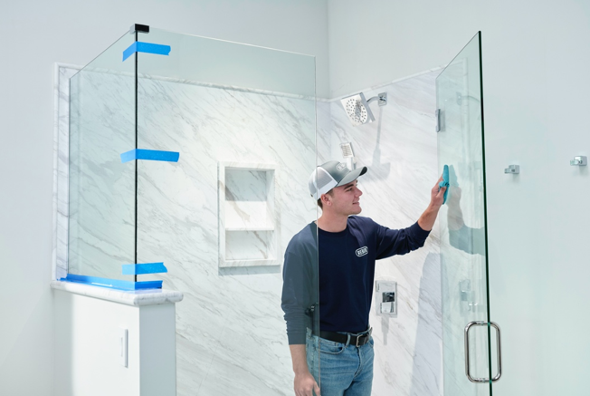 An Installer working in a new shower.